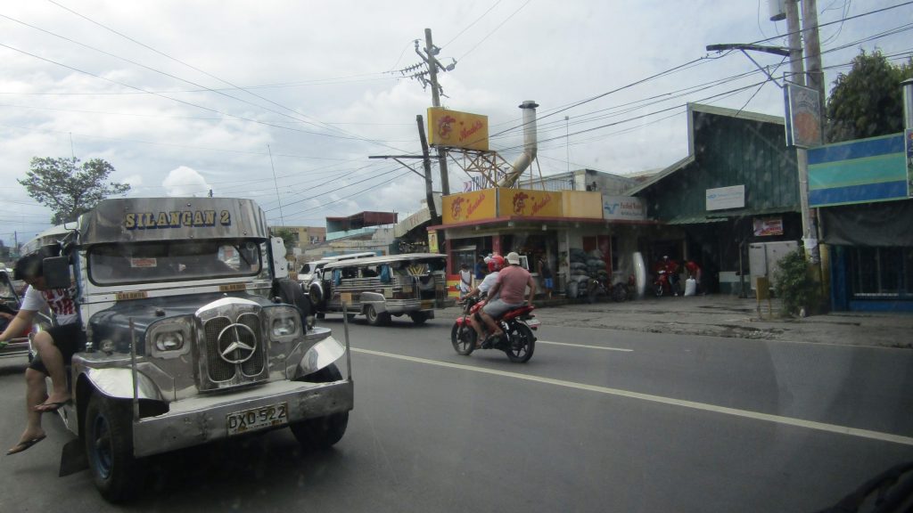 We bought some grilled chicken along the way from the popular, "Andok's Lechon" (Andok's Grill House). Jeepneys ply the national highway in Cabuyao, Laguna