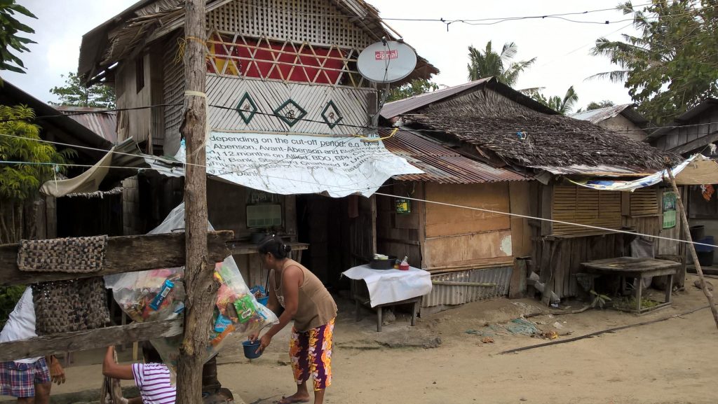 A satellite dish sticks out of Aling Baby's house in Cagbalate Island.