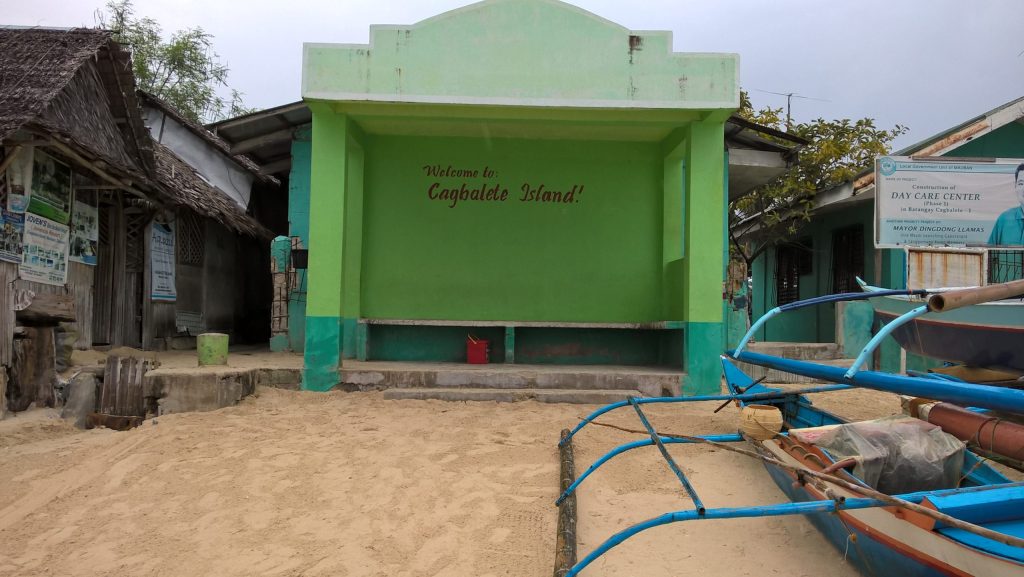 A modest 'welcome' sign awaits visitors in the port of Sabang in Cagbalete Island.