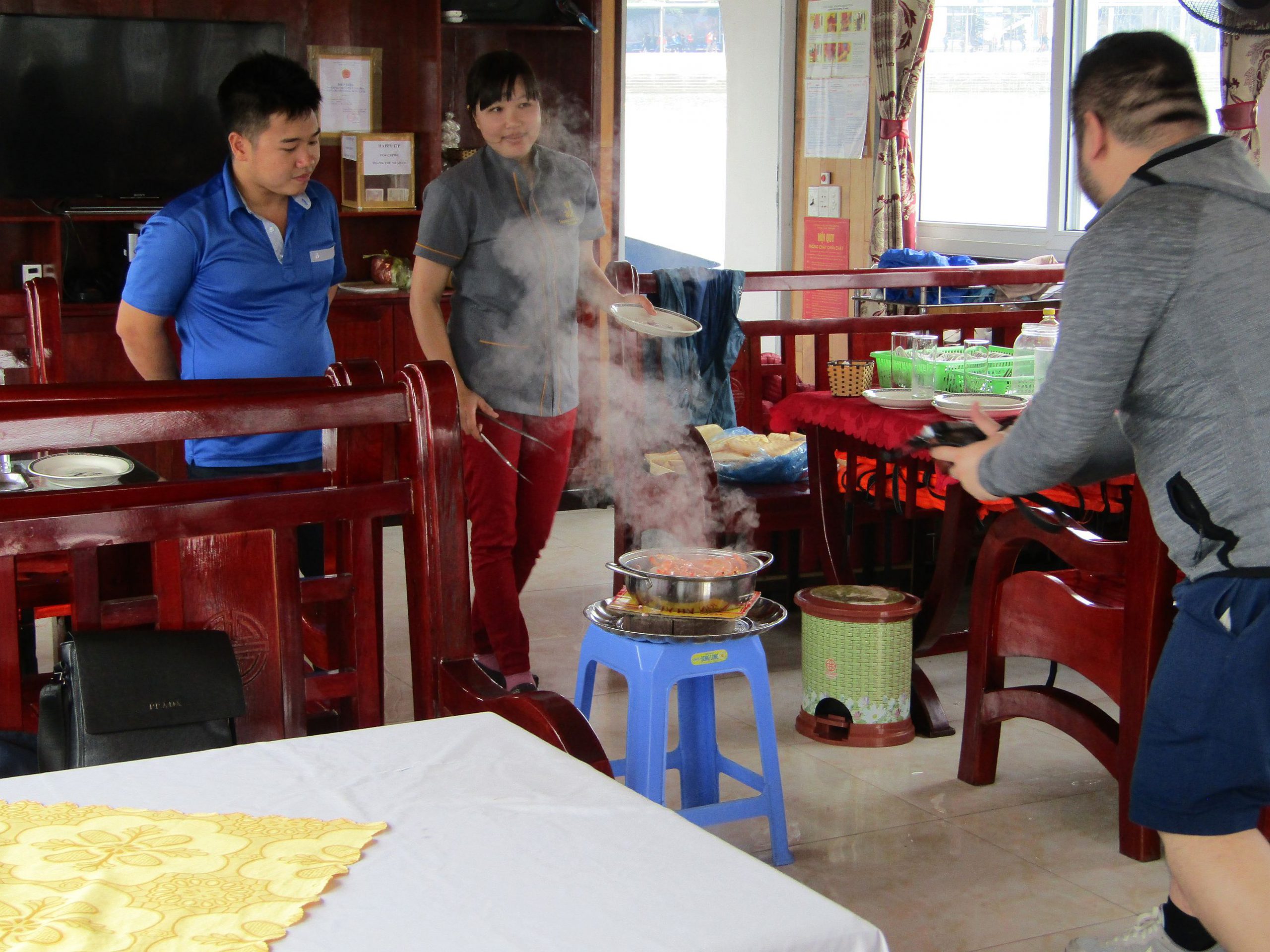 That's our Halong Bay trip tour guide, Can De (leftmost with blue shirt).