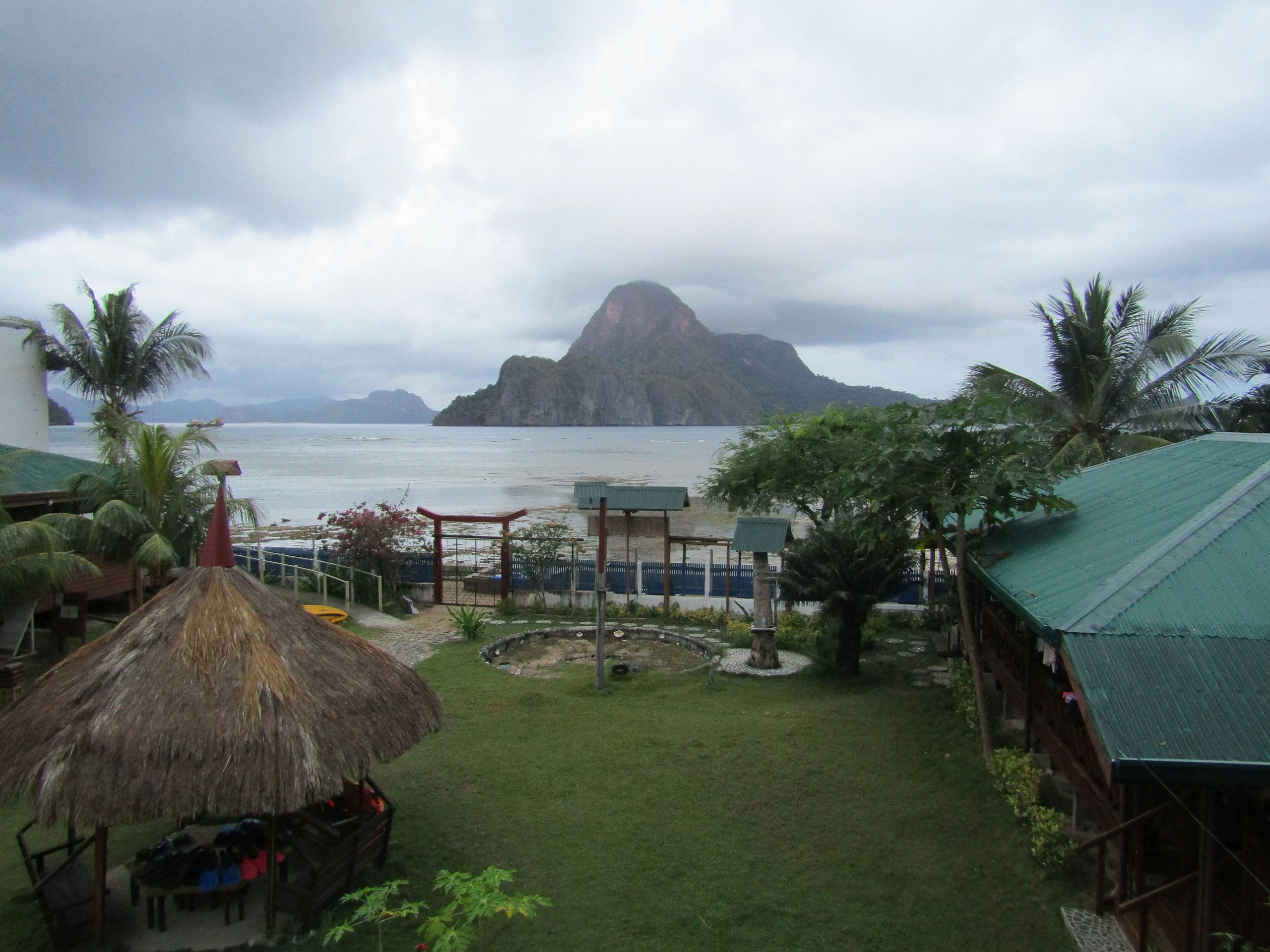 A brief demo how to use their snorkeling gear and safety vests is held in the gazebo (with the thatched roof) .