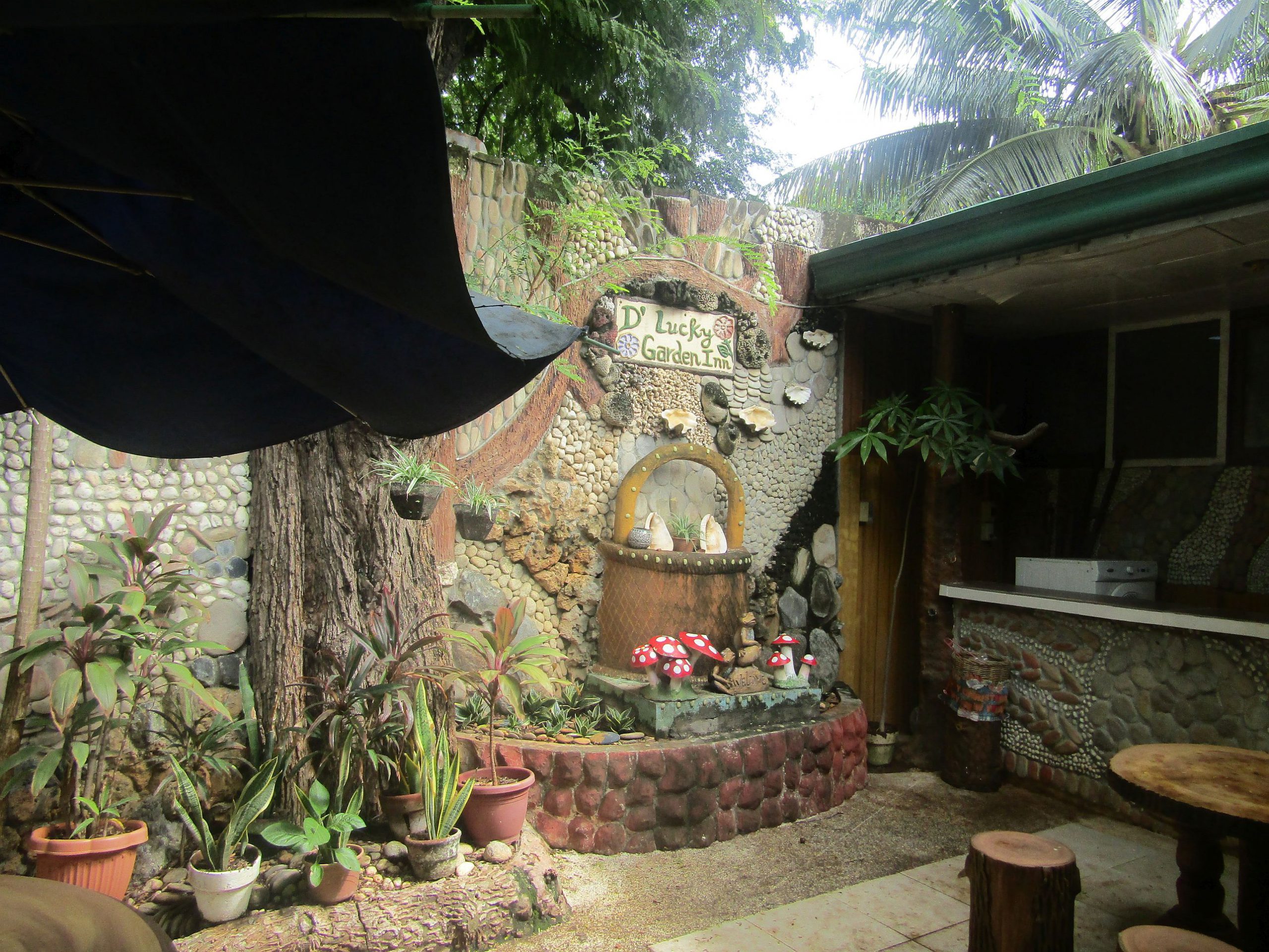 A quiet corner inside the small, eclectic garden .