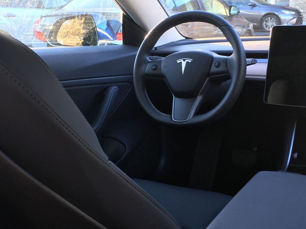 A US$ 57,000 car with only 'faux leather' seats and 'faux wood' dashboard??
